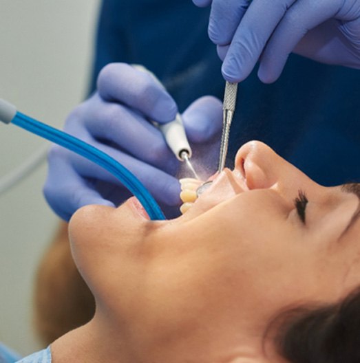 Closeup of patient having their teeth cleaned