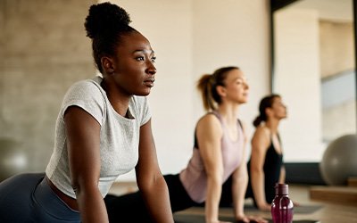 Group of women stretching in yoga class