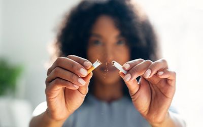 Closeup of patient breaking cigarette