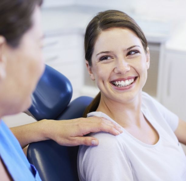 Woman smiling at her dentist in Northbrook