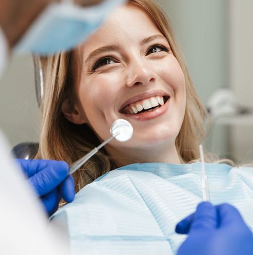 Lady smiles at Dentist