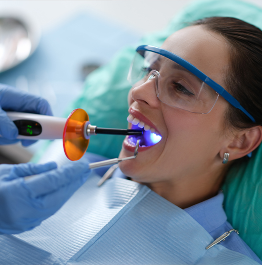 Woman receiving direct bonding from cosmetic dentist