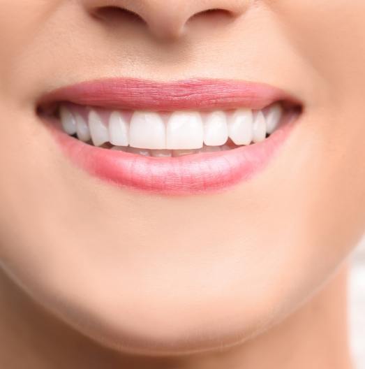 Close up of smile with white teeth and even gumline