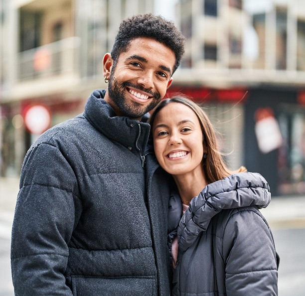 Couple with dental crowns in Northbrook