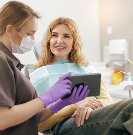 Patient and dental team member talking during consultation