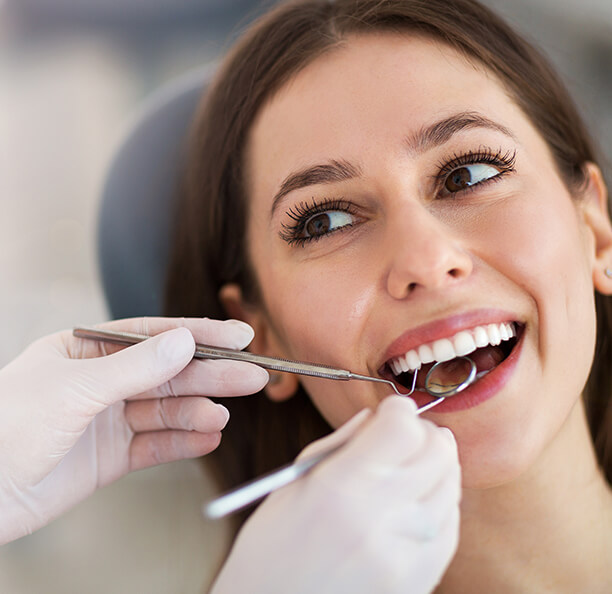 Woman smiling during restorative dentistry visit in Northbrook