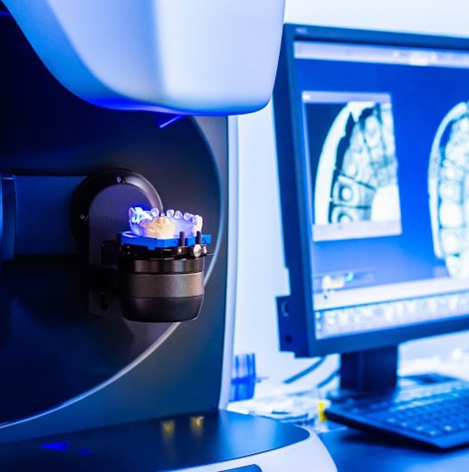Digital scans of a patient’s mouth being uploaded to a nearby same-day milling machine