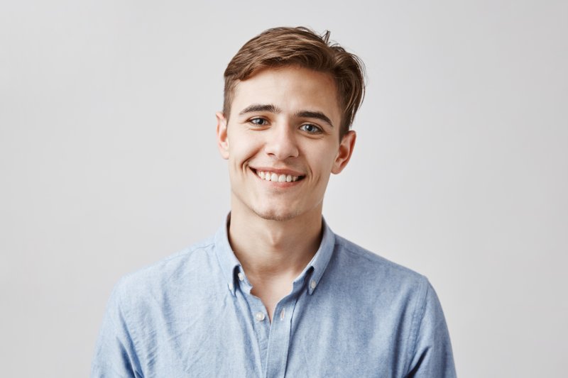 a man smiling with healthy and bright teeth